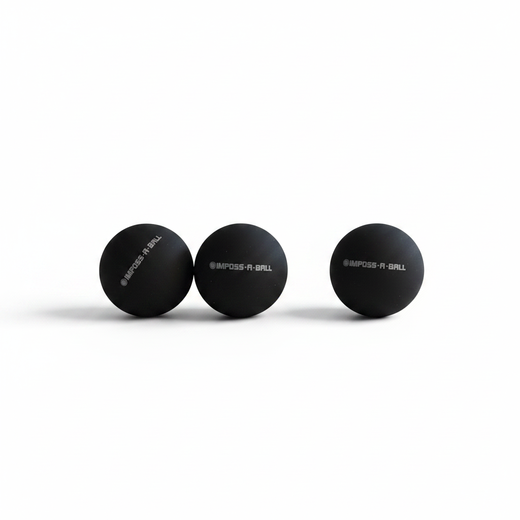 IMPOSS-A-BALL replacement rubber balls 3 pack on white surface with dramatic lighting